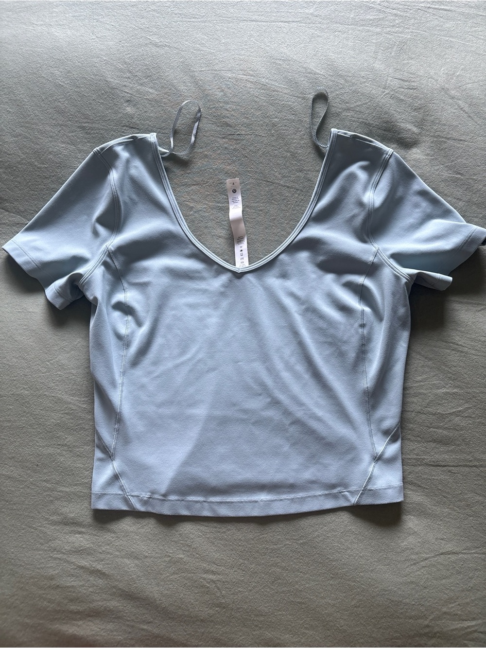 Title:
Lululemon Light Blue Short Sleeve Deep V-Neck Crop Top - Size 8